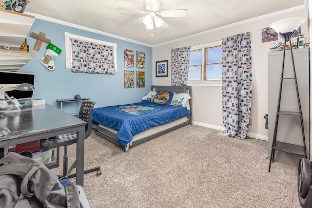 carpeted bedroom with ceiling fan, ornamental molding, and baseboards