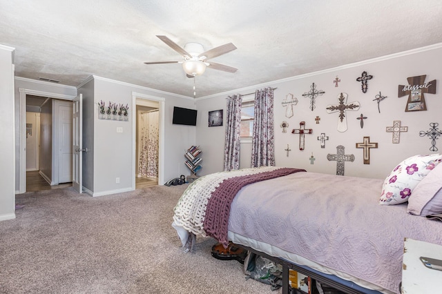 carpeted bedroom featuring baseboards, a textured ceiling, visible vents, and crown molding