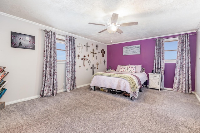 carpeted bedroom with ceiling fan, a textured ceiling, baseboards, and crown molding