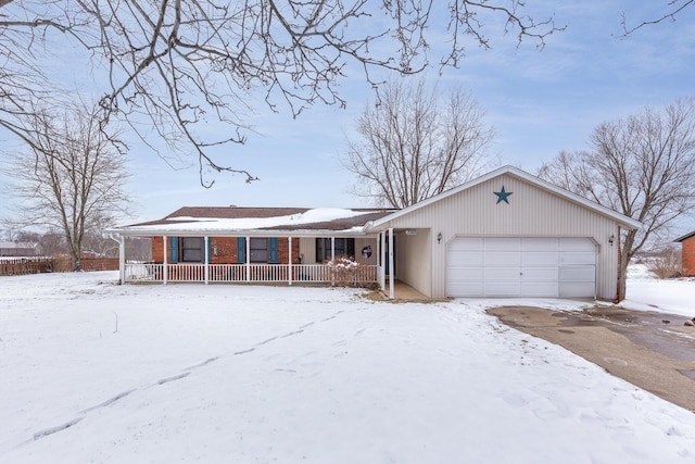 view of front of property featuring a garage and a porch