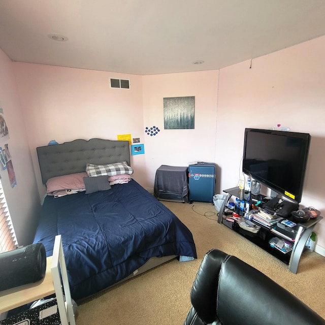 carpeted bedroom with visible vents