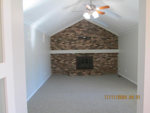 unfurnished living room featuring lofted ceiling, ornamental molding, and brick wall