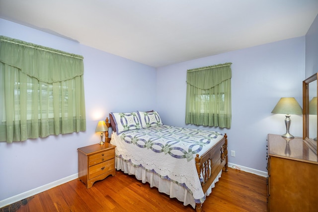 bedroom featuring dark hardwood / wood-style floors