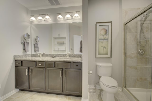 bathroom with tile patterned flooring, toilet, an enclosed shower, and vanity