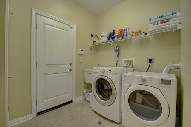 clothes washing area with washer and dryer