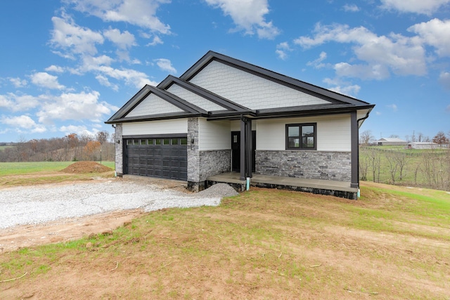 view of front of home featuring a garage and a front lawn