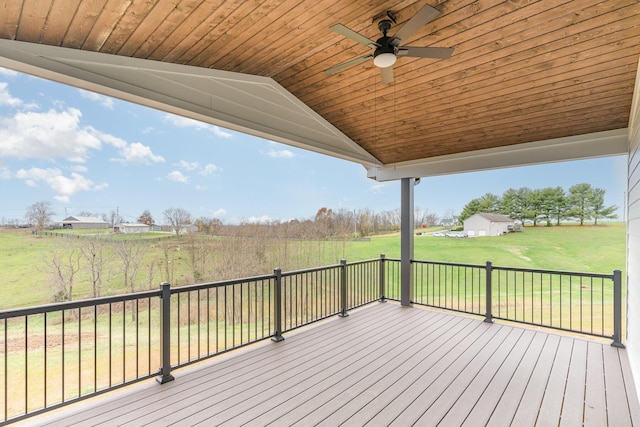 wooden deck featuring ceiling fan