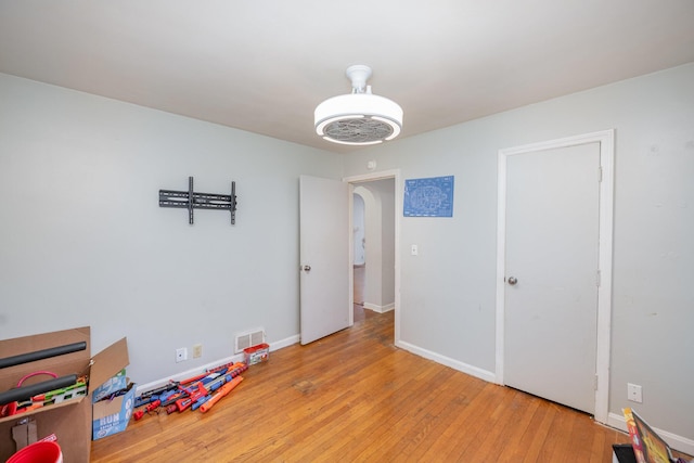 recreation room with light wood-type flooring