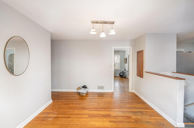 unfurnished dining area featuring light hardwood / wood-style flooring