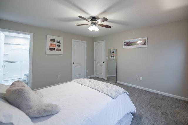 bedroom featuring dark colored carpet, ceiling fan, and connected bathroom