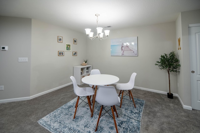 carpeted dining area with a chandelier