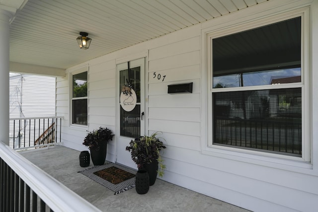 property entrance featuring covered porch