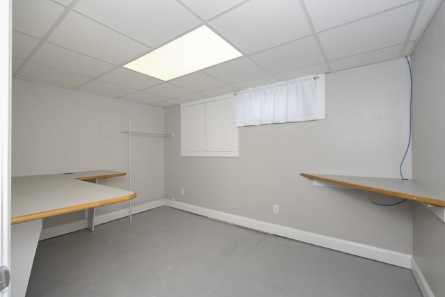 basement featuring a drop ceiling