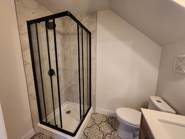 bathroom with vanity, toilet, walk in shower, and lofted ceiling