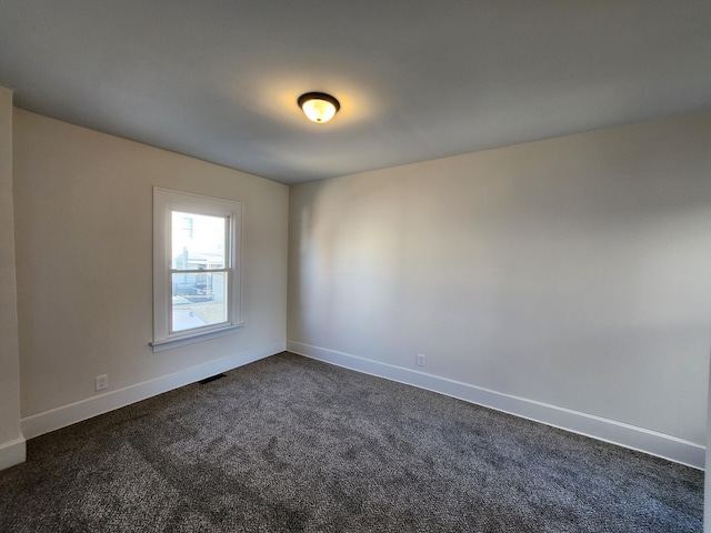 927 Boone St, Newport, KY 41071 - spare room with baseboards and dark colored carpet