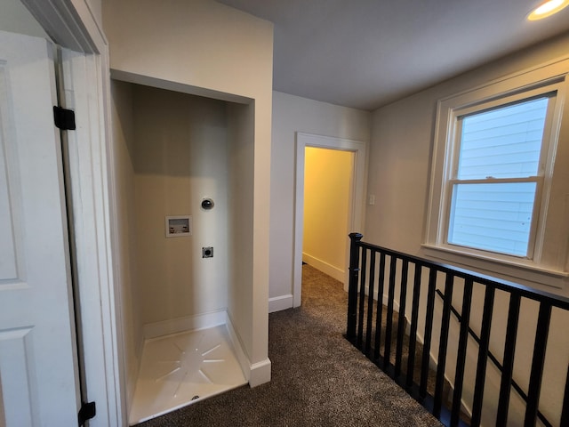 corridor featuring dark colored carpet