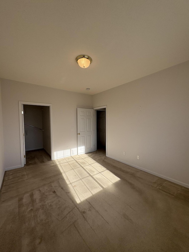 unfurnished bedroom with light carpet