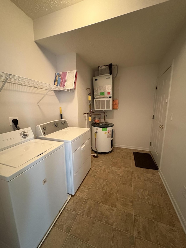 washroom with washer and dryer, heating unit, and water heater