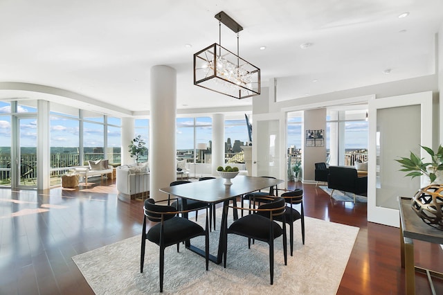 dining room featuring dark hardwood / wood-style flooring and a chandelier