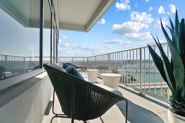 balcony featuring a water view