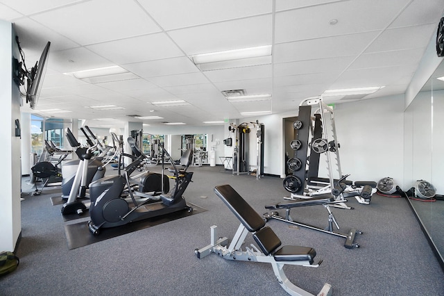 exercise room featuring a paneled ceiling