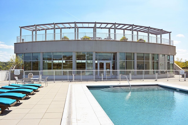 view of swimming pool with a patio area