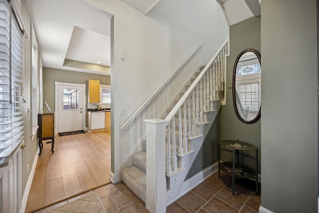 staircase with wood-type flooring