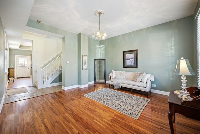 living room featuring hardwood / wood-style floors and a chandelier