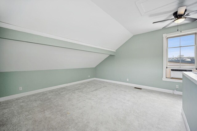 bonus room with carpet flooring, ceiling fan, cooling unit, and vaulted ceiling