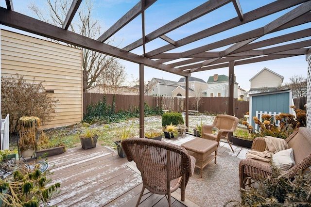 wooden deck with a storage unit and a pergola