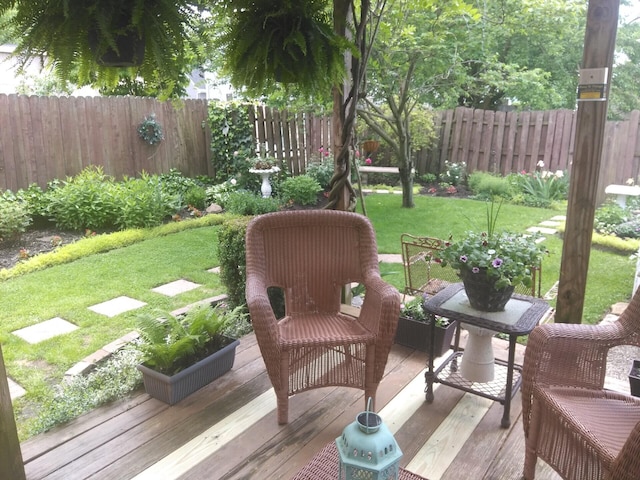 wooden terrace with a yard