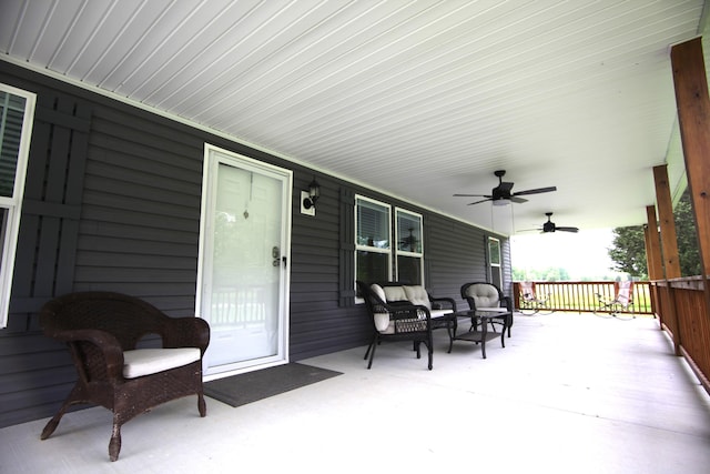 view of patio featuring ceiling fan and a porch