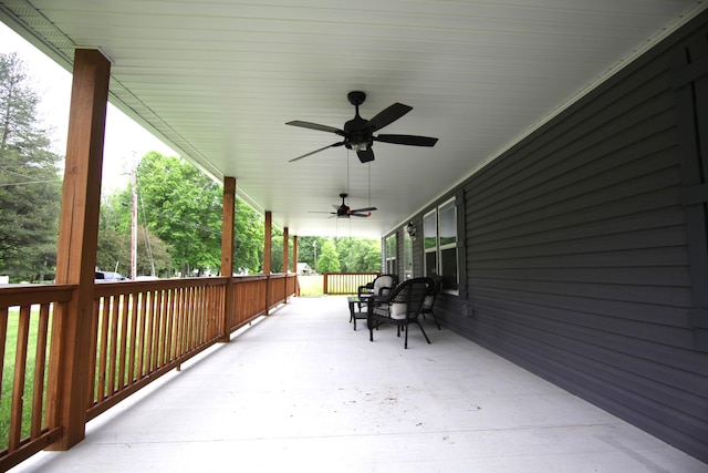 view of patio / terrace with ceiling fan and a porch