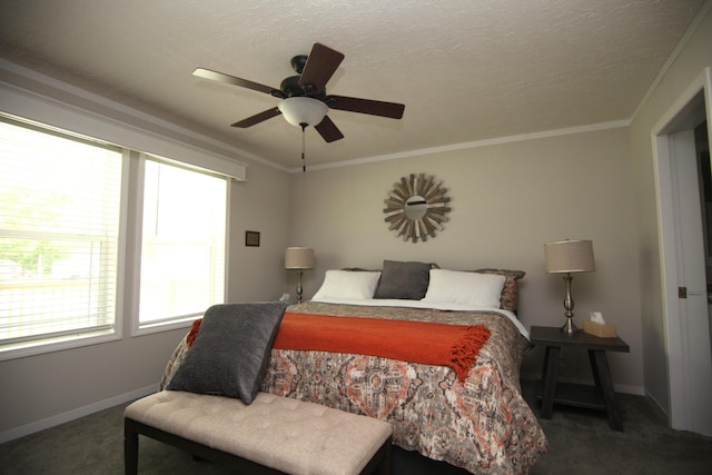 bedroom featuring dark colored carpet, ceiling fan, a textured ceiling, and crown molding