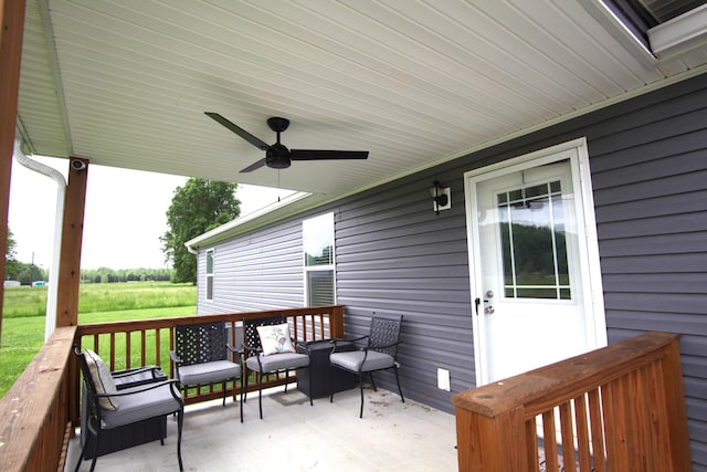 wooden deck with ceiling fan