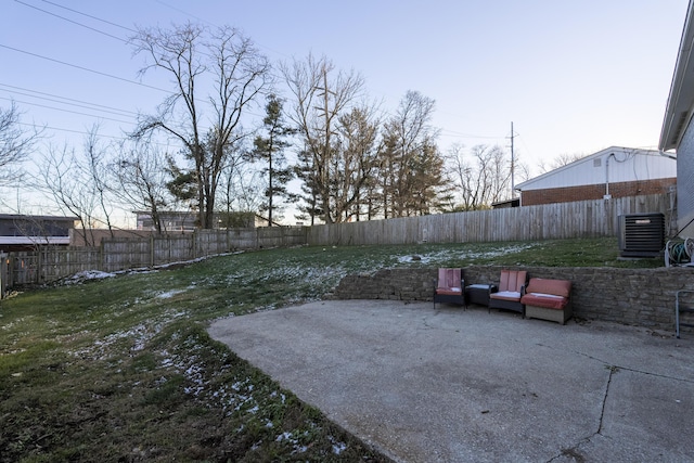 view of yard featuring central air condition unit and a patio