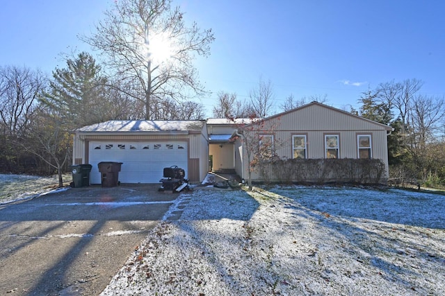 single story home featuring a garage