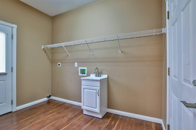 laundry area featuring sink, cabinets, dark wood-type flooring, electric dryer hookup, and hookup for a washing machine