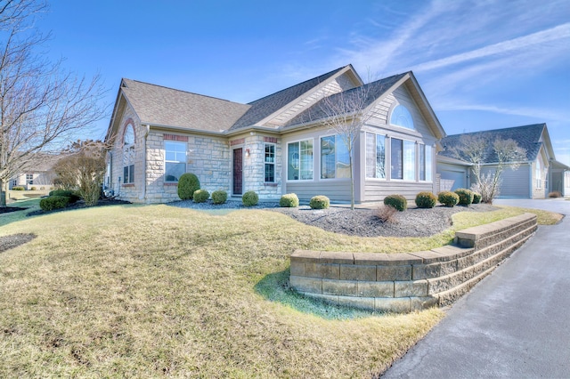 view of front of home featuring a garage and a front yard