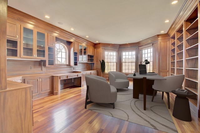 office space with recessed lighting, light wood-style floors, and ornamental molding