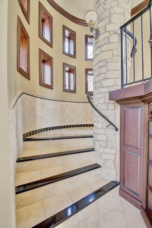 stairs with tile patterned floors