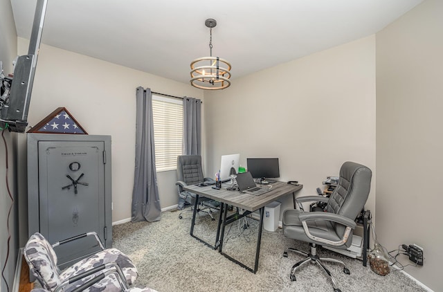 carpeted office featuring a chandelier