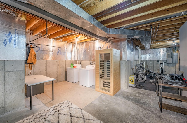 basement featuring washing machine and clothes dryer