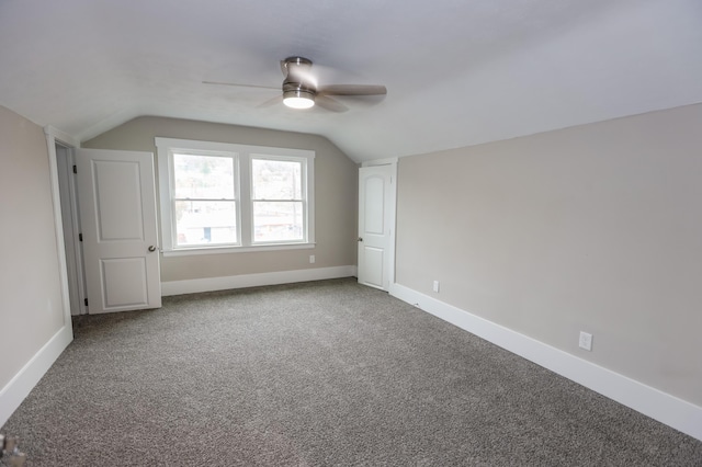 additional living space featuring ceiling fan, carpet floors, and lofted ceiling