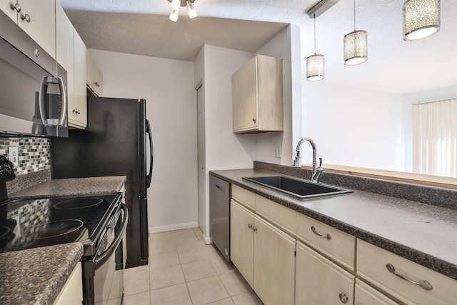 kitchen with sink, hanging light fixtures, stainless steel appliances, backsplash, and light tile patterned flooring