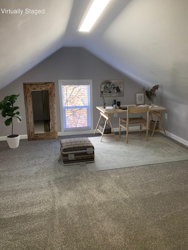 interior space featuring carpet and vaulted ceiling