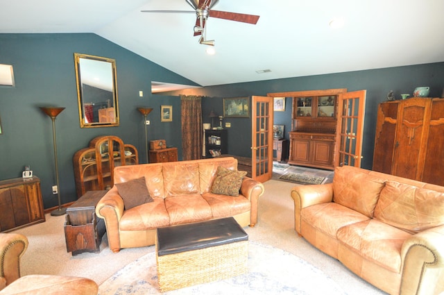 carpeted living room featuring ceiling fan, french doors, and lofted ceiling