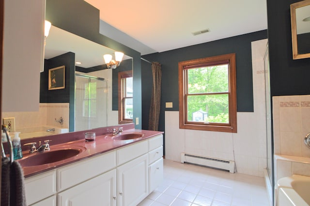 bathroom with tile patterned floors, shower with separate bathtub, tile walls, and a baseboard radiator