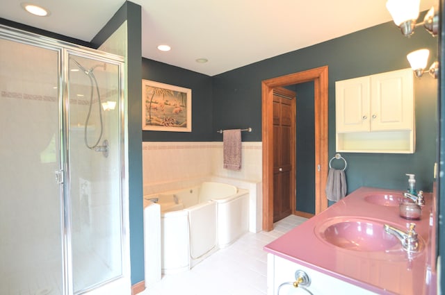 bathroom featuring separate shower and tub, tile patterned flooring, and vanity