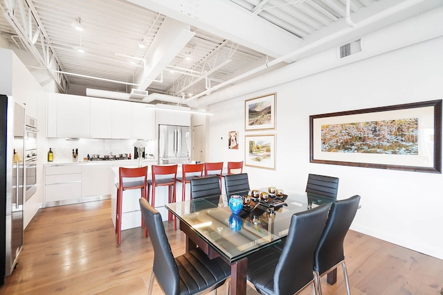 dining room with light hardwood / wood-style floors